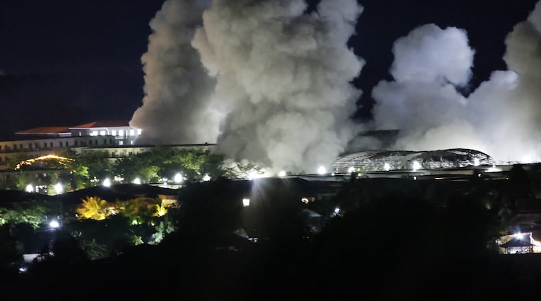 FILE - White smoke billows after an explosion at KK Park online scam center in Myawaddy township, Karen State, Myanmar, Saturday, Oct. 25, 2025. (AP Photo/Sarot Meksophawannakul, File)