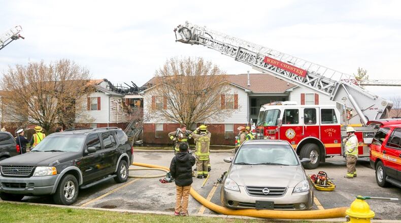 West Chester firefighters, shown fighting another recent fire at an apartment complex, battled a fire this morning that caused a portion of U.S. 42 to close down as they put out the blaze. GREG LYNCH/STAFF