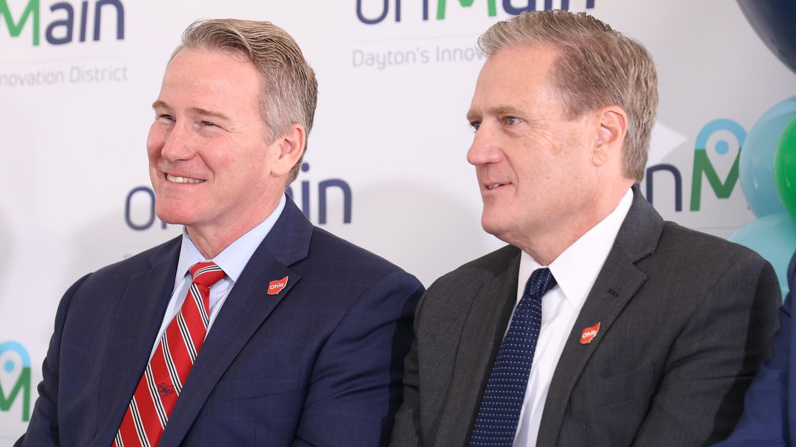Sen. Jon Husted (R-Upper Arlington, left) and U.S. Rep. Mike Turner (R-Dayton) listen on Friday, Sept. 26 during a groundbreaking ceremony for the first stage of onMain's development of the former Montgomery County Fairgrounds in Dayton. Both helped bring the project to fruition. BRYANT BILLING / STAFF