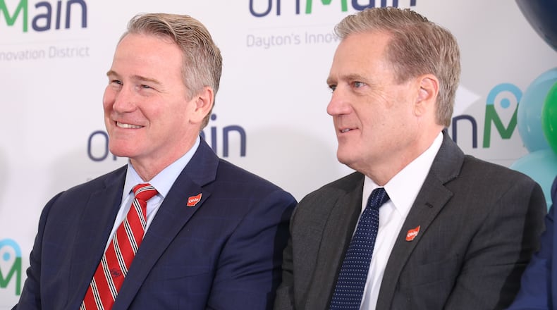 Sen. Jon Husted (R-Upper Arlington, left) and U.S. Rep. Mike Turner (R-Dayton) listen on Friday, Sept. 26 during a groundbreaking ceremony for the first stage of onMain's development of the former Montgomery County Fairgrounds in Dayton. Both helped bring the project to fruition. BRYANT BILLING / STAFF