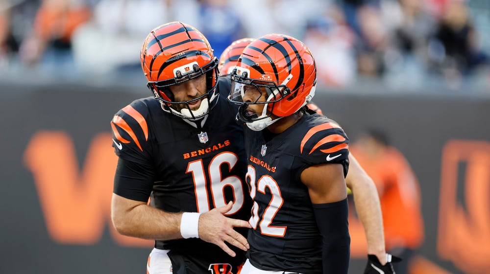 Cincinnati Bengals wide receiver Mitchell Tinsley (82) celebrates with teammate quarterback Joe Flacco (16) after catching a touchdown pass during the second half of an NFL football game against the New England Patriots, Sunday, Nov. 23, 2025, in Cincinnati. (AP Photo/Jay LaPrete)