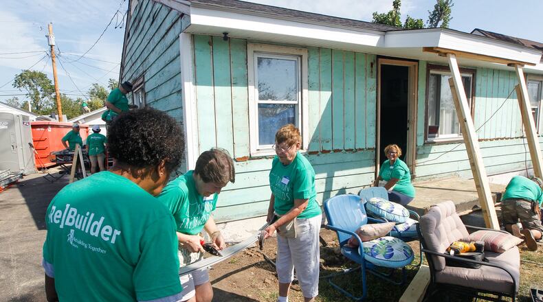 Volunteers from Shiloh Church work Thursday, Sept. 19, 2019, to help Jessica Brady’s house in Harrison Twp. The rebuilding project is the first tornado-damaged home to be repaired through a partnership of non-profit organizations formed following the Memorial Day natural disaster. CHRIS STEWART / STAFF