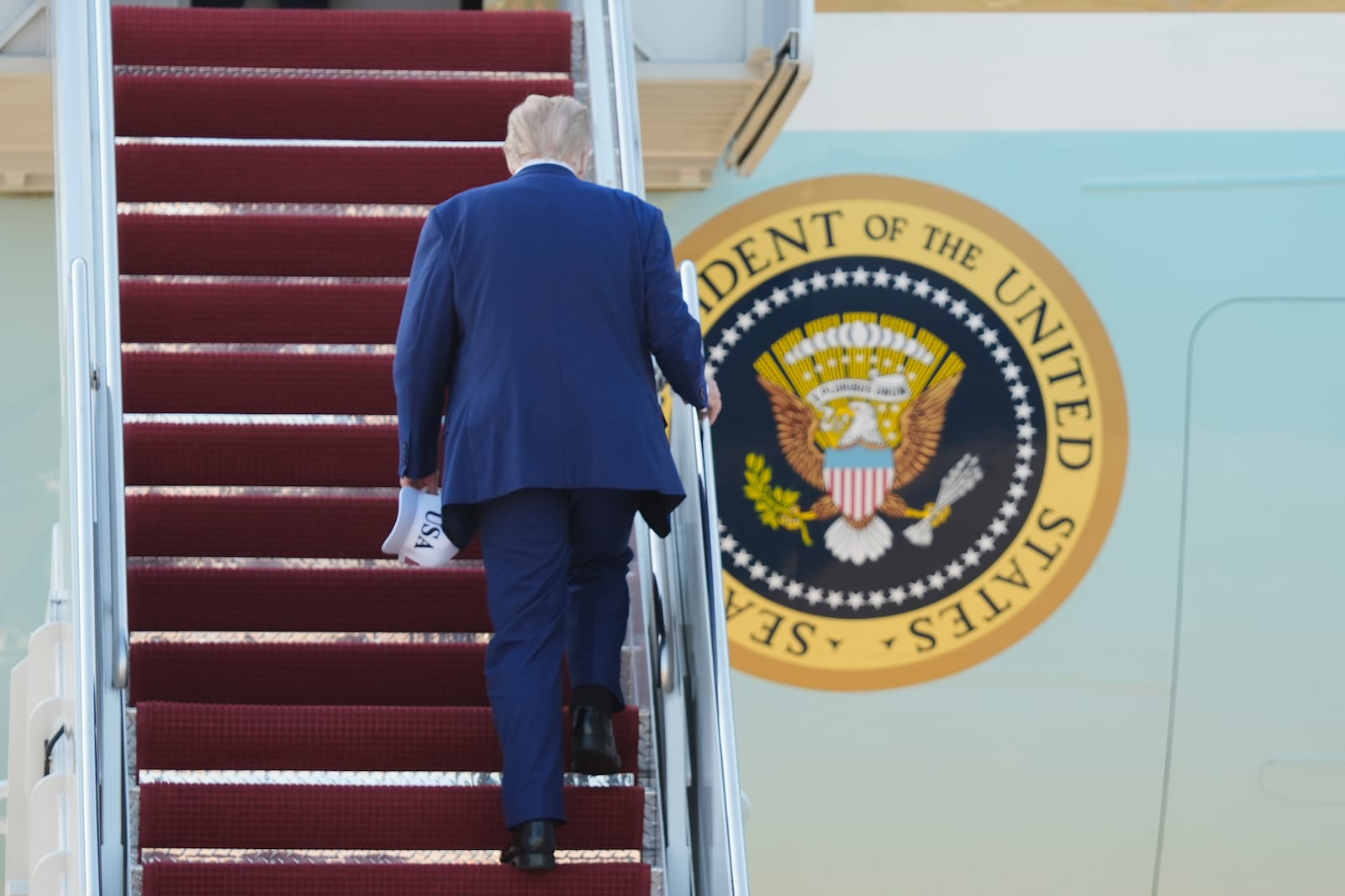 President Donald Trump boards Air Force One, Tuesday, June 24, 2025, at Joint Base Andrews, Md., on his way to The Hague, to join world leaders gathering in the Netherlands for a two-day NATO summit. (AP Photo/Manuel Balce Ceneta)