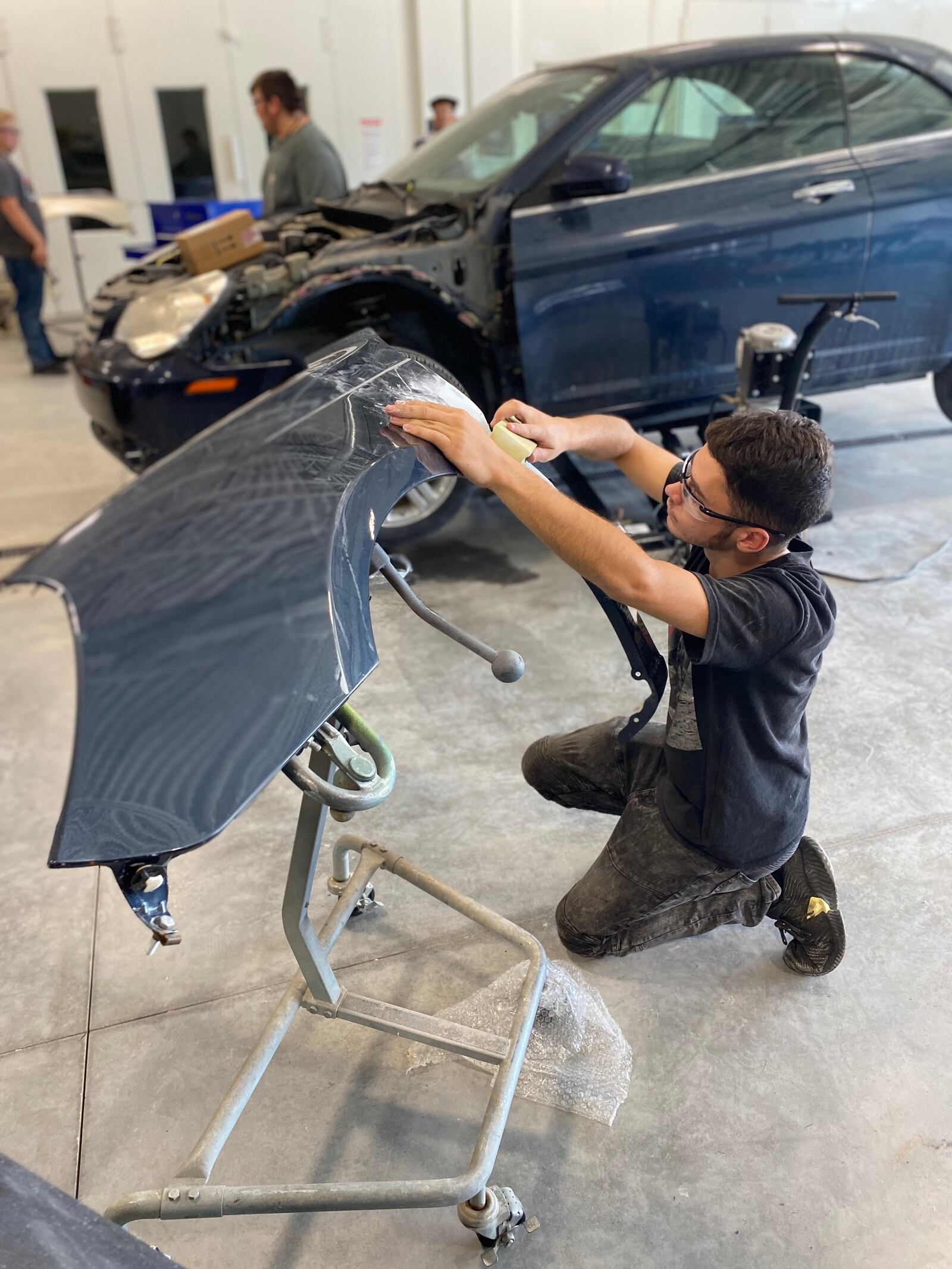 Auto collision program students work in their lab in the newly constructed north wing of the Miami Valley Career Technology Center in Englewood. Contributed photo
