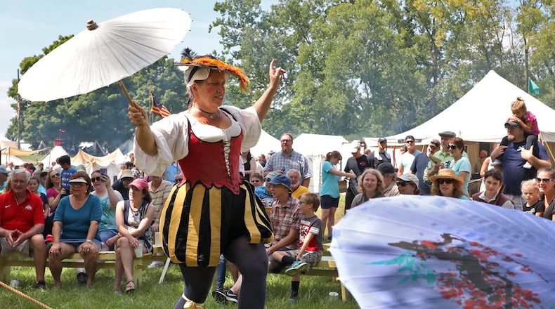 Signora Bella entertains the crowd at the Fair at New Boston by walking on a slack rope during her show in 2018. BILL LACKEY/STAFF