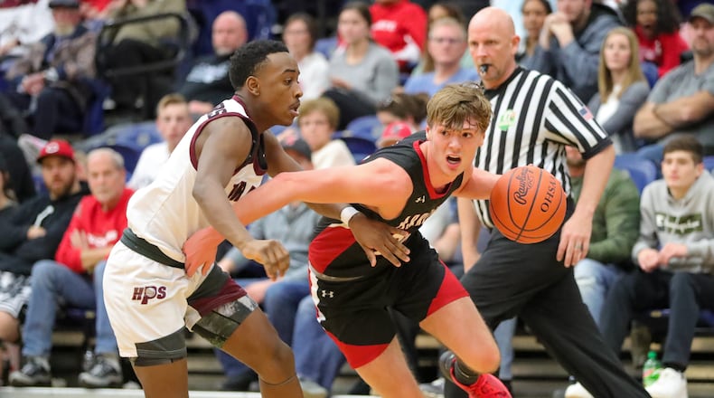 Preble Shawnee's Mason Shrout drives past a Harvest Prep defender during the Division III regional final game Saturday, March 11, 2023 at Trent Arena in Kettering. CONTRIBUTED PHOTO BY MICHAEL COOPER