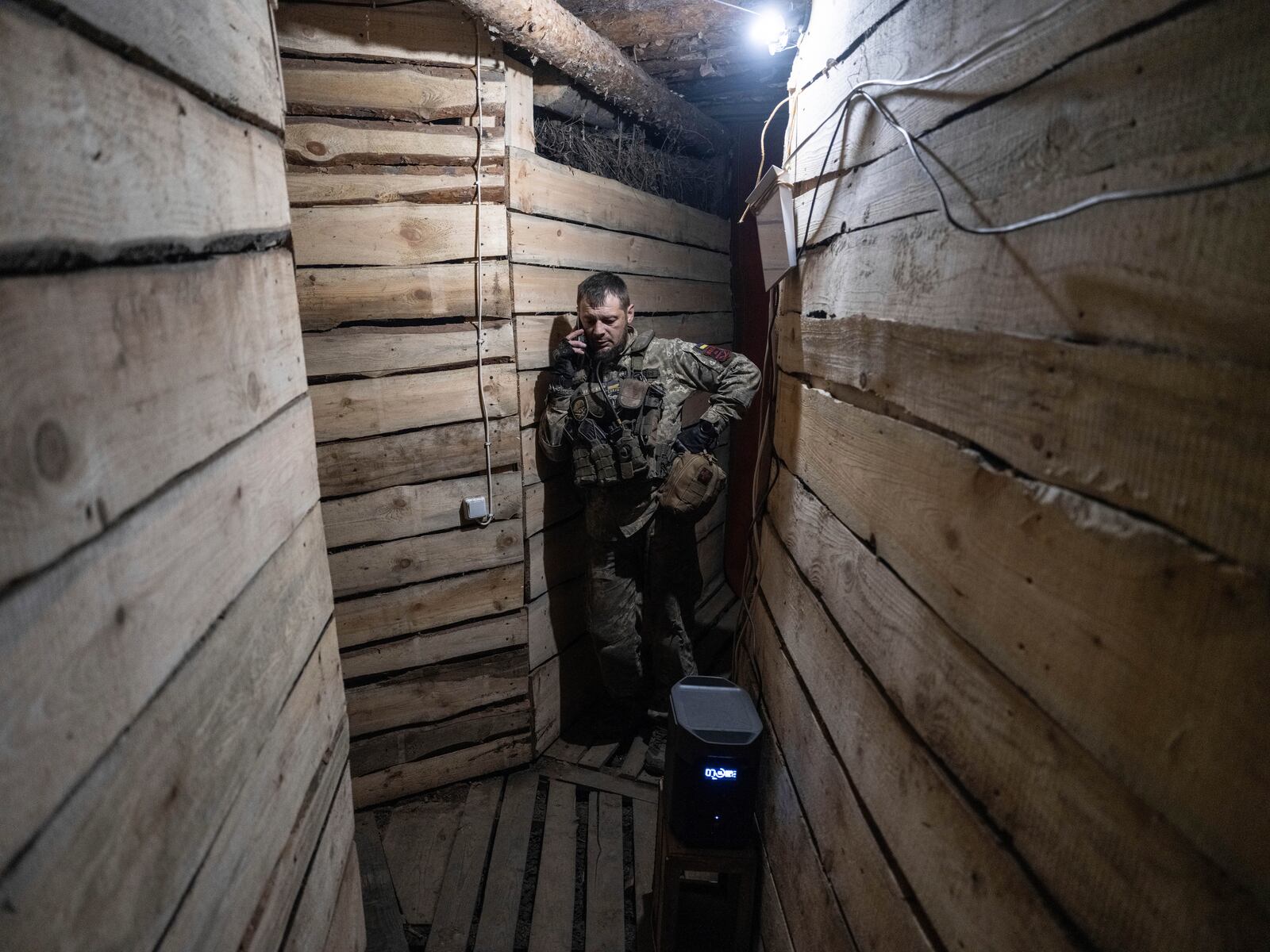 In this photo provided by Ukraine's 93rd Kholodnyi Yar Separate Mechanized Brigade press service, a soldier talks on the phone in a shelter in Kostyantynivka, the site of the heavy battles with the Russian troops in the Donetsk region, Ukraine, Thursday, April 24, 2025. (Iryna Rybakova/Ukraine's 93rd Mechanized Brigade via AP).