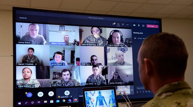 Tech. Sgt. William Klemmer, Airman Leadership School instructor, teaches via distance learning protocol under Health Protection Condition Charlie at Wright-Patterson Air Force Base Sept. 16. Klemmer instructs half of a class of 22 students. (U.S. Air Force photo/Ty Greenlees)