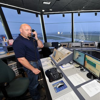 Bill Masseth, an air traffic controller at Springfield Beckley Municipal Airport, at work in the airport’s traffic control tower in 2013. FILE