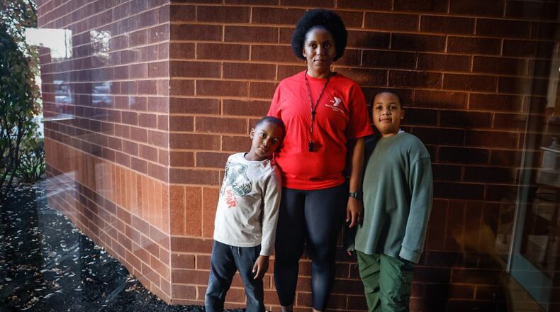 Ashley Brown and her two sons, Dominic, left, and Leonne survived a horrific accident, and with the help of Premier Health and Dayton Children's, the family are back on their feet. JIM NOELKER/STAFF