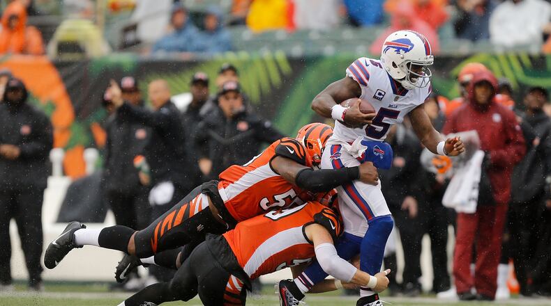 CINCINNATI, OH - OCTOBER 8: Vontaze Burfict #55 of the Cincinnati Bengals and Nick Vigil #59 of the Cincinnati Bengals attempt to tackle Tyrod Taylor #5 of the Buffalo Bills during the third quarter at Paul Brown Stadium on October 8, 2017 in Cincinnati, Ohio. (Photo by Michael Reaves/Getty Images)