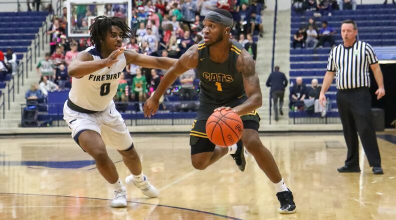 Springfield High School’s Larry Stephens drives the ball to the basket against Fairmont’s Danye Lewis during their game on Friday night at Trent Arena. The Firebirds won 51-46. CONTRIBUTED PHOTO BY MICHAEL COOPER