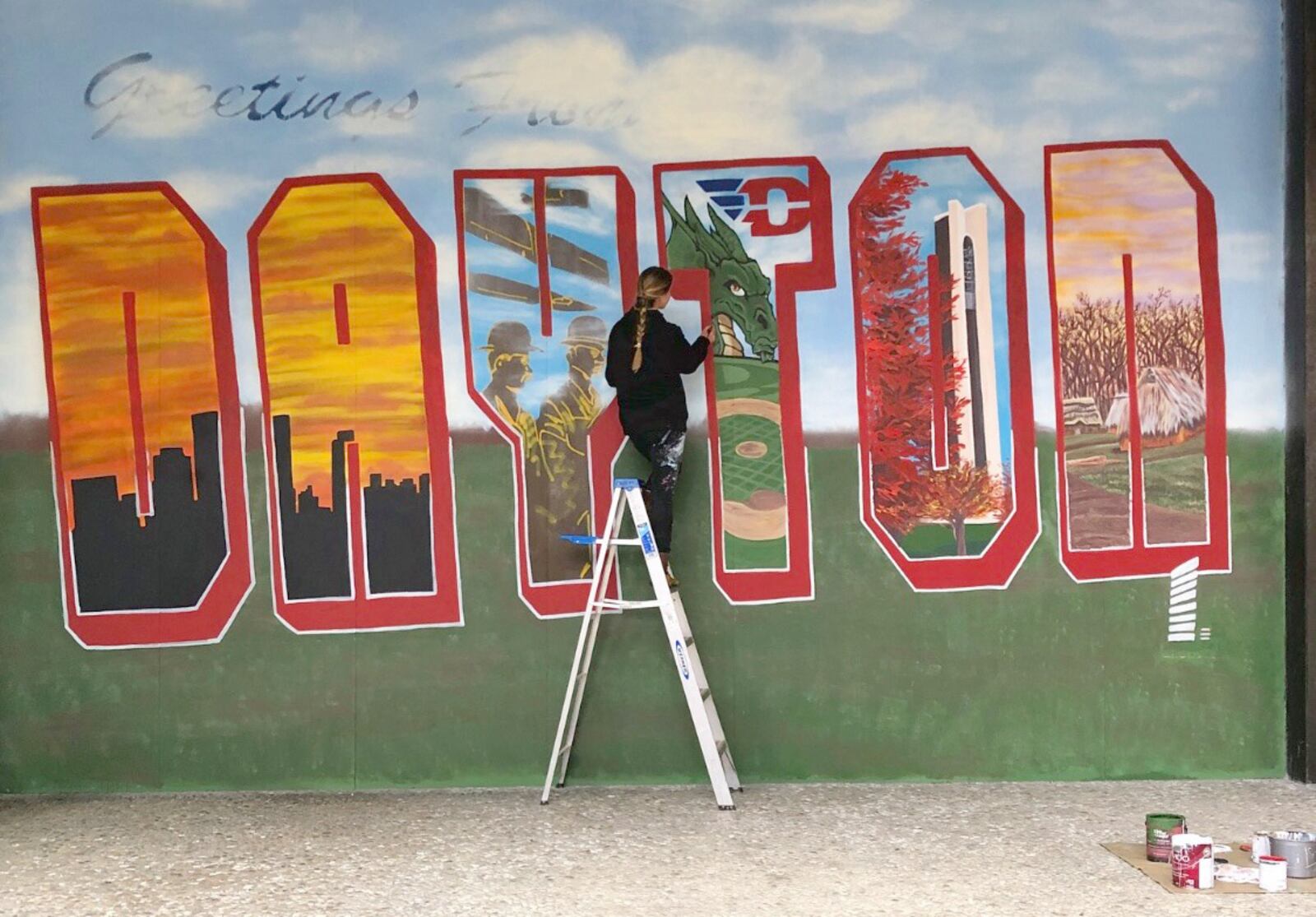 Erica Arndts, a mural artist who grew up in Centerville, has created a vintage postcard mural on Stratacache Tower in Dayton. CONTRIBUTED PHOTO