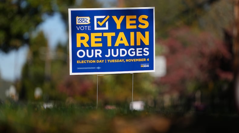 A sign is posted in support of retaining Pennsylvania Supreme Court justices in the November election, in Berwyn, Pa., Wednesday, Oct. 22, 2025. (AP Photo/Matt Rourke)