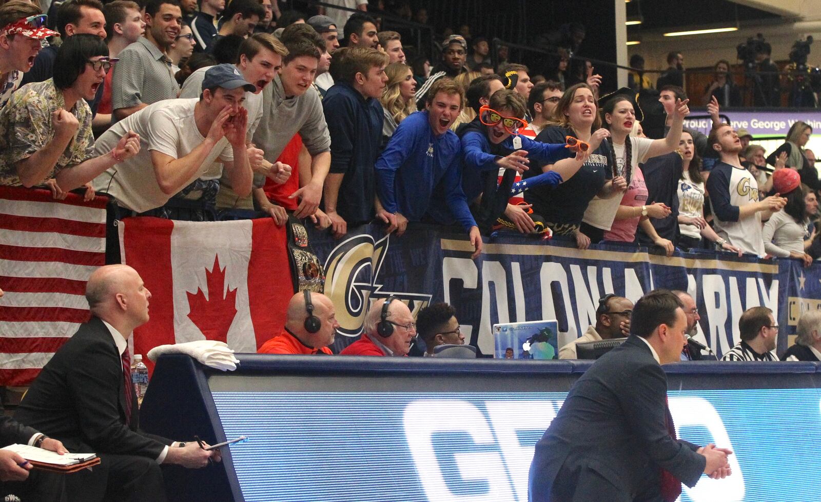 George Washington fans yell at Dayton coach Archie Miller on Saturday, March 4, 2017, at the Smith Center in Washington, D.C.
