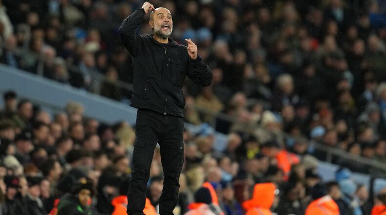 Manchester City's head coach Pep Guardiola reacts during the English Premier League soccer match between Manchetser City nad Newcastle in Manchester, England, Saturday, Feb. 21, 2026. (AP Photo/Jon Super)