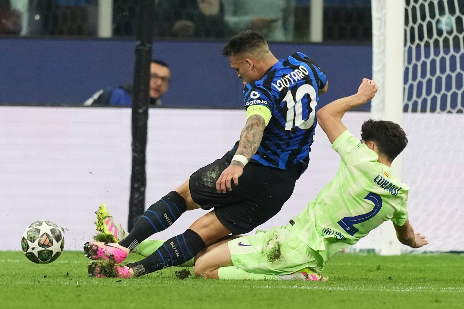 Barcelona's Pau Cubarsi fouls Inter Milan's Lautaro Martinez inside the penalty box during the Champions League semifinal second leg soccer match between Inter Milan and Barcelona at San Siro stadium in Milan , Italy, Tuesday, May 6, 2025. (AP Photo/Antonio Calanni)