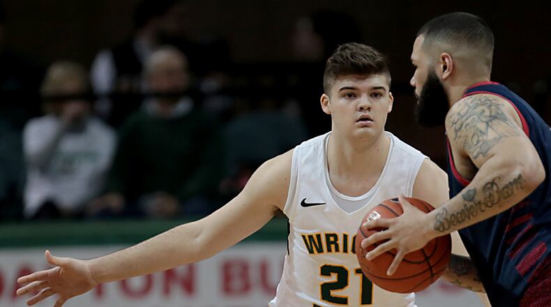 Wright State University forward Grant Basile covers Detroit Mercy forward Justin Miller during their Horizon League game at the Nutter Center in Fairborn Thursday, Feb. 6, 2020. Wright State won 98-86. Contributed photo by E.L. Hubbard