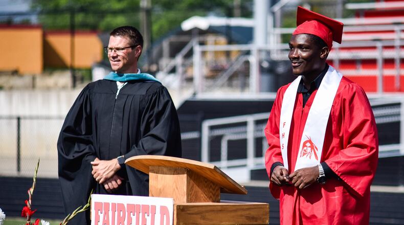 Arnold Nwanazia was one of many Fairfield High School seniors participating in a diploma and photo event Wednesday, May 27 at Fairfield Stadium to celebrate their graduation. Seniors and family signed up for 10-minute time slots to get theri diploma and walk around the track and field at Fairfield Stadium to get photos at several locations, walk across the stage and ring the bell. NICK GRAHAM / STAFF