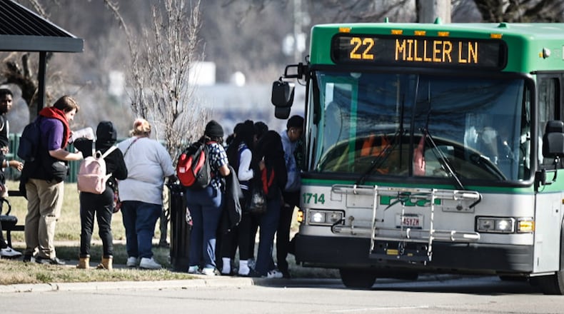 Students from Ponitz High School load onto an RTA bus on Edwin C. Moses Blvd. Thursday February 23, 2023. JIM NOELKER/STAFF