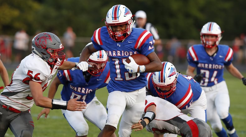 Northwestern’s Jalen Minney breaks through the Southeastern defense for a first down during Friday’s season opener. Bill Lackey/Staff