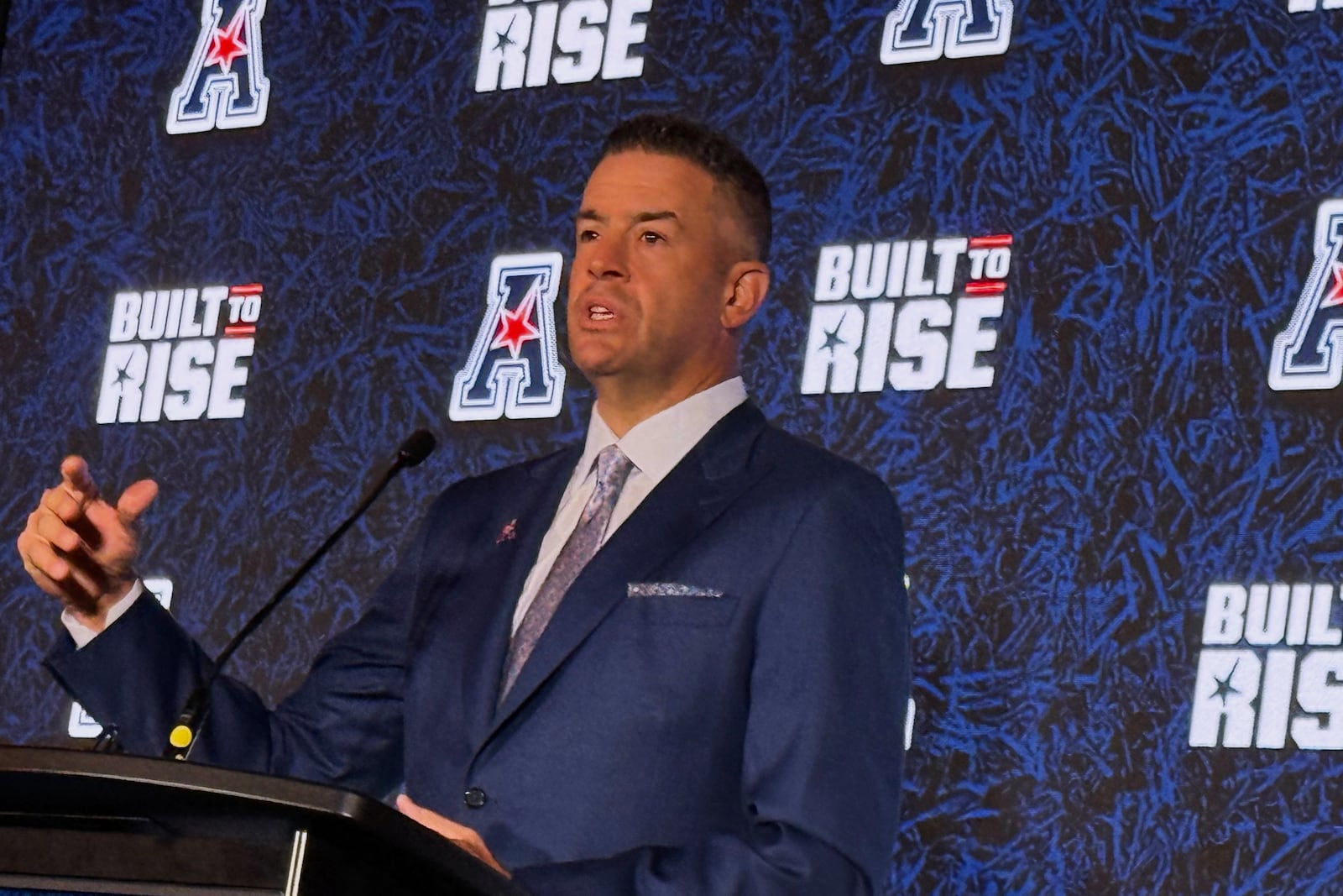 American Conference commissioner Tim Pernetti speaks at Media Days on Friday, July 25, 2025 in Charlotte, N.C. (AP Photo/Steve Reed)
