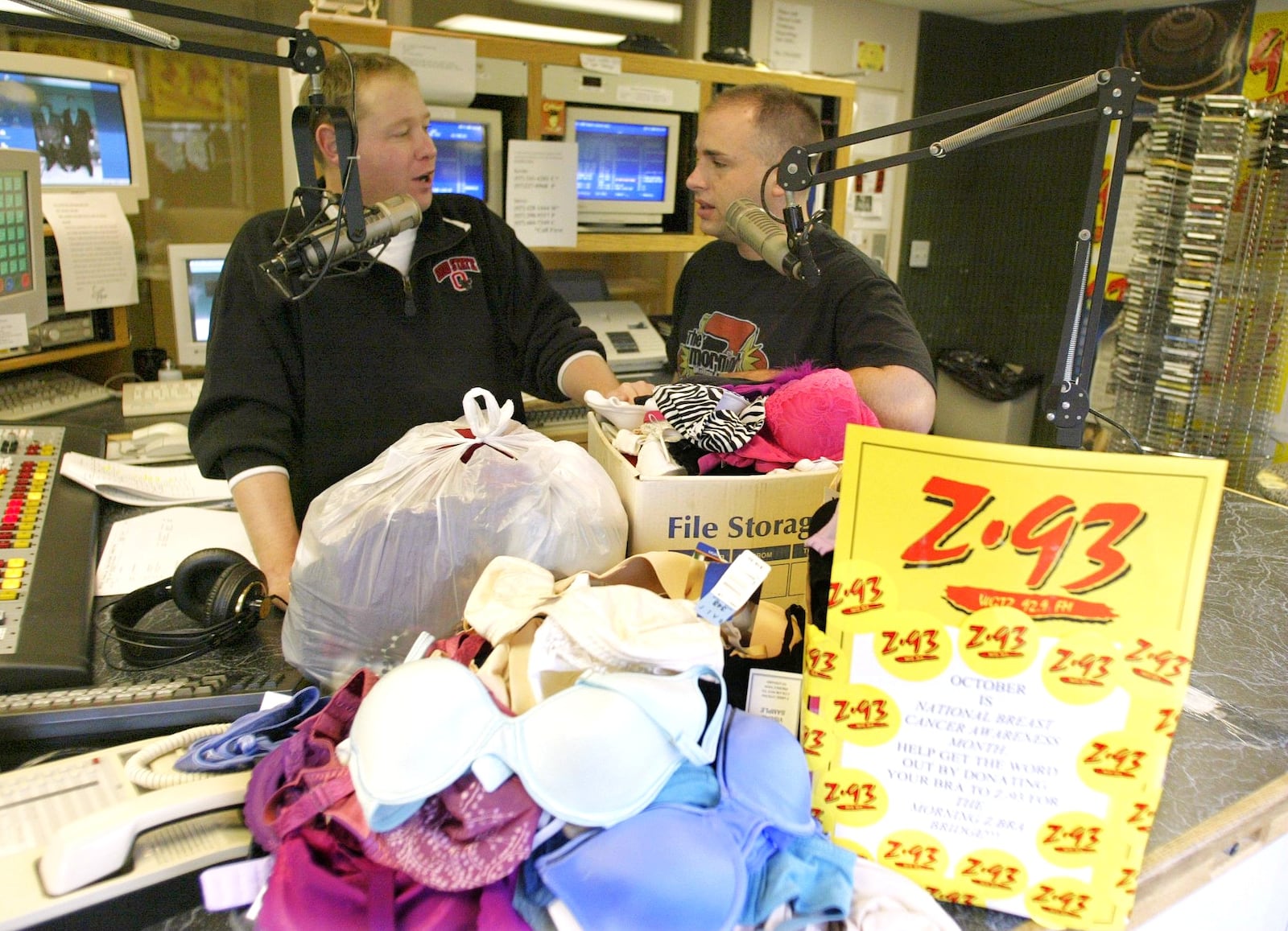 Z-93 morning hosts Mike "Campy" Campana, left, and Scott Mallory talks about their program to collect 500 bras for Breast Cancer Awareness in 2003. Elder Beerman, T J Maxx and K-mart have donated, along with many local women who are breast cancer survivors. They have collected almost 400 as of Friday. DAYTON DAILY NEWS ARCHIVES
