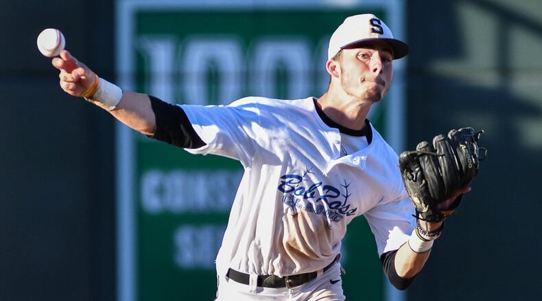 Springfield shortstop Avery Swigart throws to first base during the Bob Ross Classic on Saturday night at Fifth Third Field. Swigart hit .410 last season for the Wildcats and had 19 RBIs. BRYANT BILLING / CONTRIBUTED
