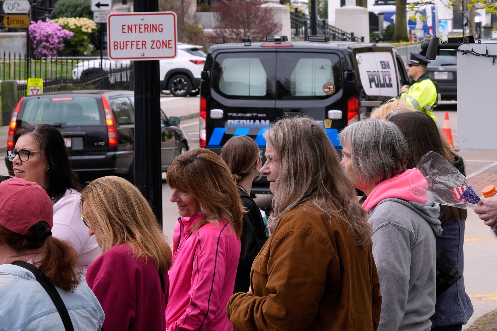 Supporters of Karen Read gather outside a buffer zone and watch Read's trial at Norfolk Superior Court, Tuesday, April 22, 2025, in Dedham, Mass. (AP Photo/Charles Krupa)