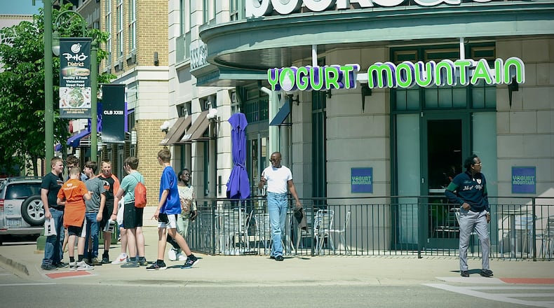 Shoppers walk from store to store at The Greene Town Center in Beavercreek on Tuesday, May 16, 2024. MARSHALL GORBY / STAFF