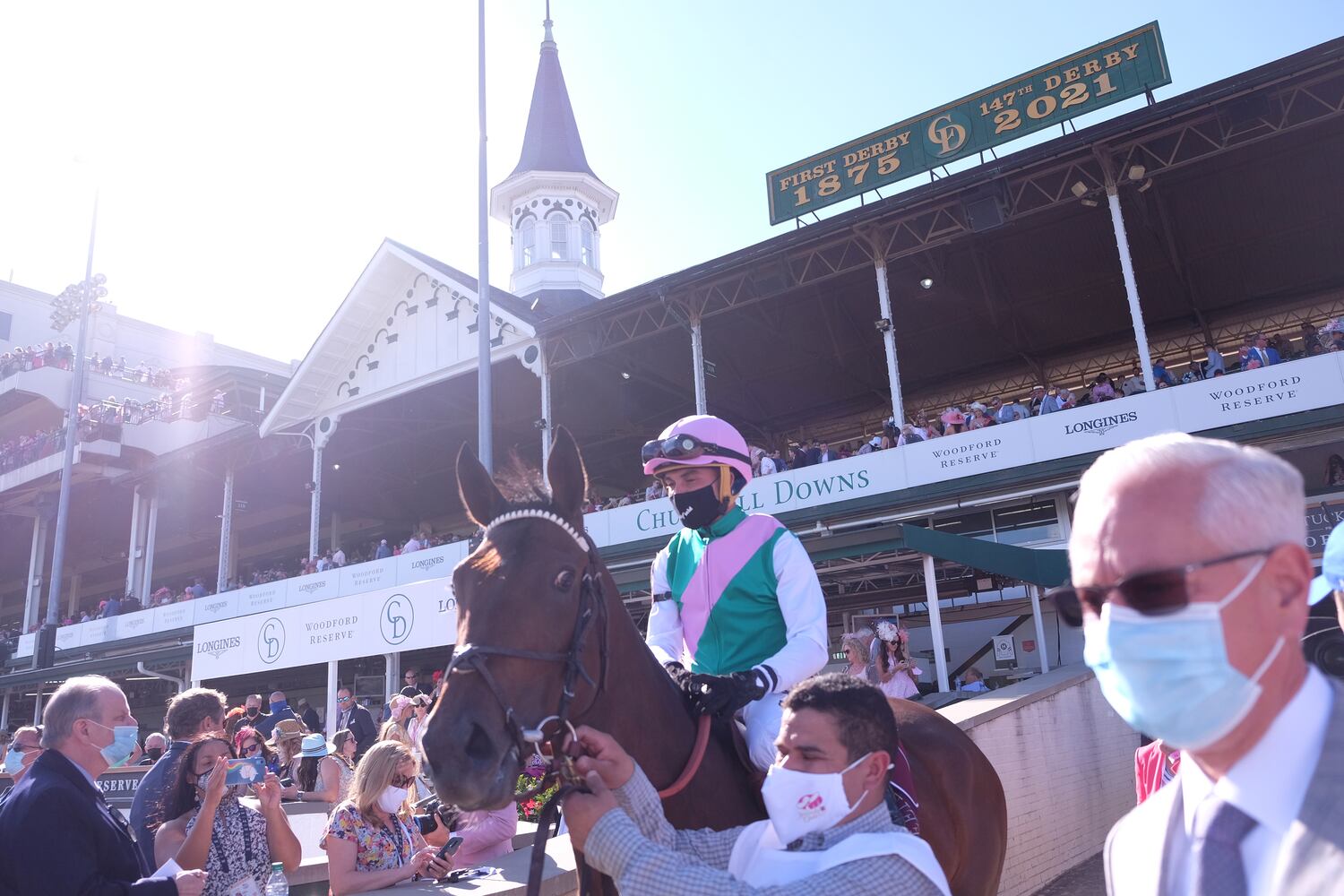 A jockey is lead to the track on Friday, April 30, 2021, at Churchill Downs in Louisville, Ky. (Christian Hansen/The New York Times)