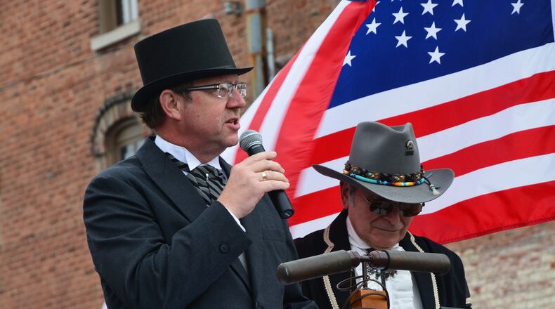 Tipp City Mayor Pat Hale (left) and resident Ron Re participate in the Tipp City 175th anniversary celebration during the 2015 July 4 weekend. The celebration sparked rebirth of expanded community July 4 activities that continue this year. CONTRIBUTED