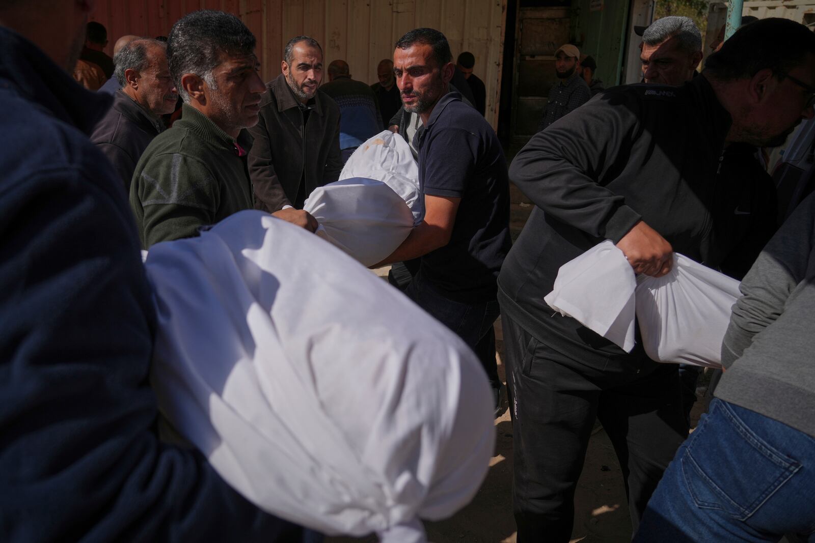 Palestinians prepare for burial the bodies of several members of the al-Atal family, killed in an Israeli airstrike on a tent in the Jabalia refugee camp, at the Indonesian hospital in Beit Lahia, northern Gaza Strip, Thursday, April 17, 2025.(AP Photo/(AP Photo/Jehad Alshrafi)