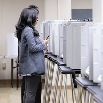 Voters cast ballots during early voting on Tuesday, Oct. 7 at Montgomery County Board of Elections. BRYANT BILLING / STAFF