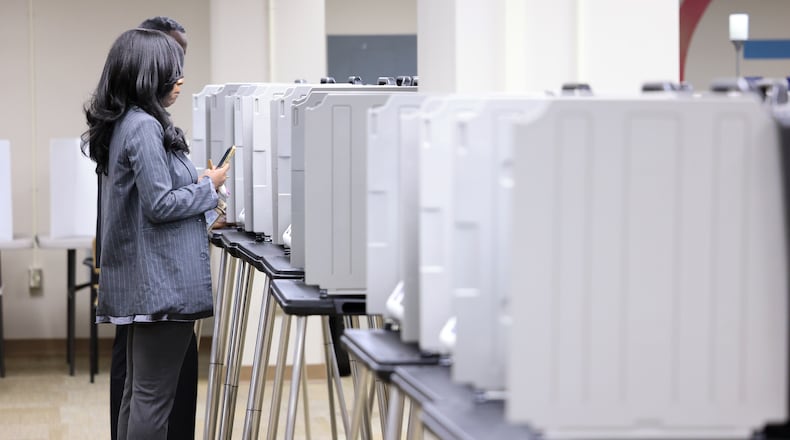 Voters cast ballots during early voting on Tuesday, Oct. 7 at Montgomery County Board of Elections. BRYANT BILLING / STAFF