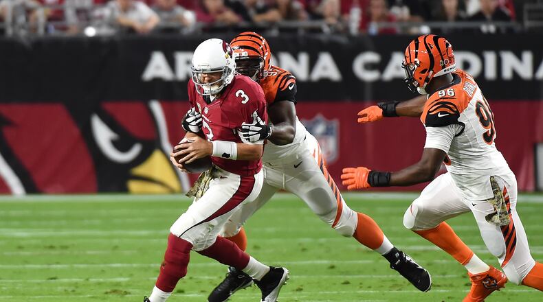 Bengals defensive tackle Geno Atkins gets ready to lay the hammer to former teammate Carson Palmer of the Cardinals in a 2015 game in Arizona.