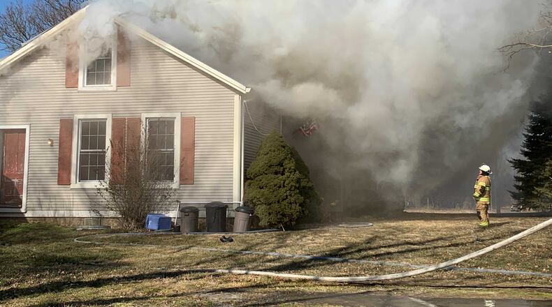 Heavy smoke and flames were reported at at a house fire on New Love Road in Harmony Twp. on Friday, Jan. 29. 2021. BILL LACKEY/STAFF