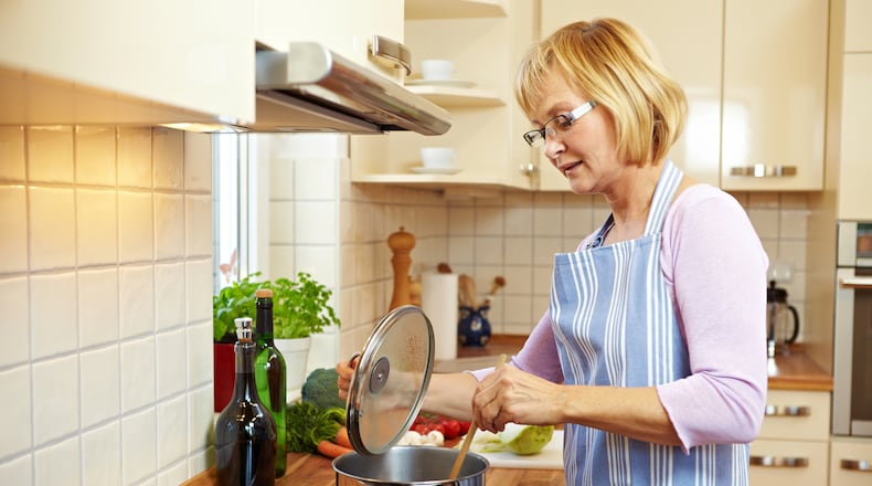 Electric cooktops can be safer options for for seniors who are choosing to stay in their homes as they age. SHUTTERSTOCK