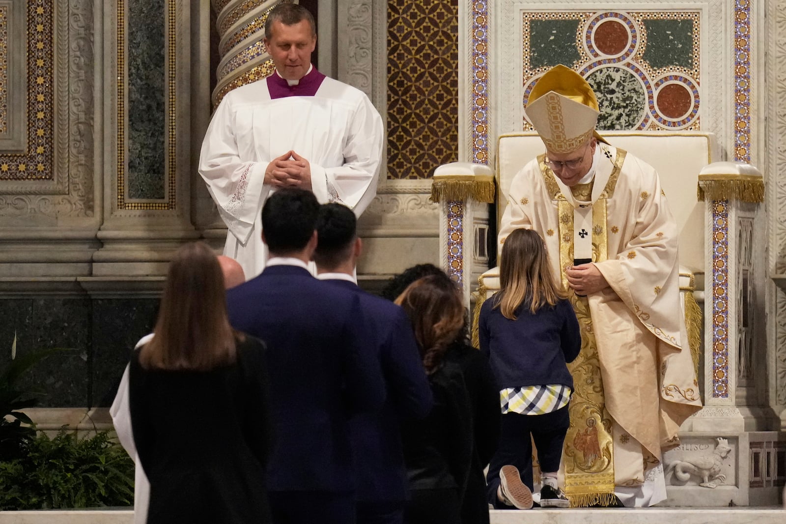 Pope Leo XIV presides over a Mass in the Archbasilica of St. John Lateran and takes possession of the Roman Cathedra, formalizing his role as Bishop of Rome in Rome, Sunday, May 25, 2025. (AP Photo/Gregorio Borgia)