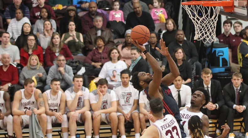 Dayton’s Josh Cunningham scores against Fordham on Saturday, Jan. 26, 2019, at Rose Hill Gym in Bronx, N.Y. David Jablonski/Staff