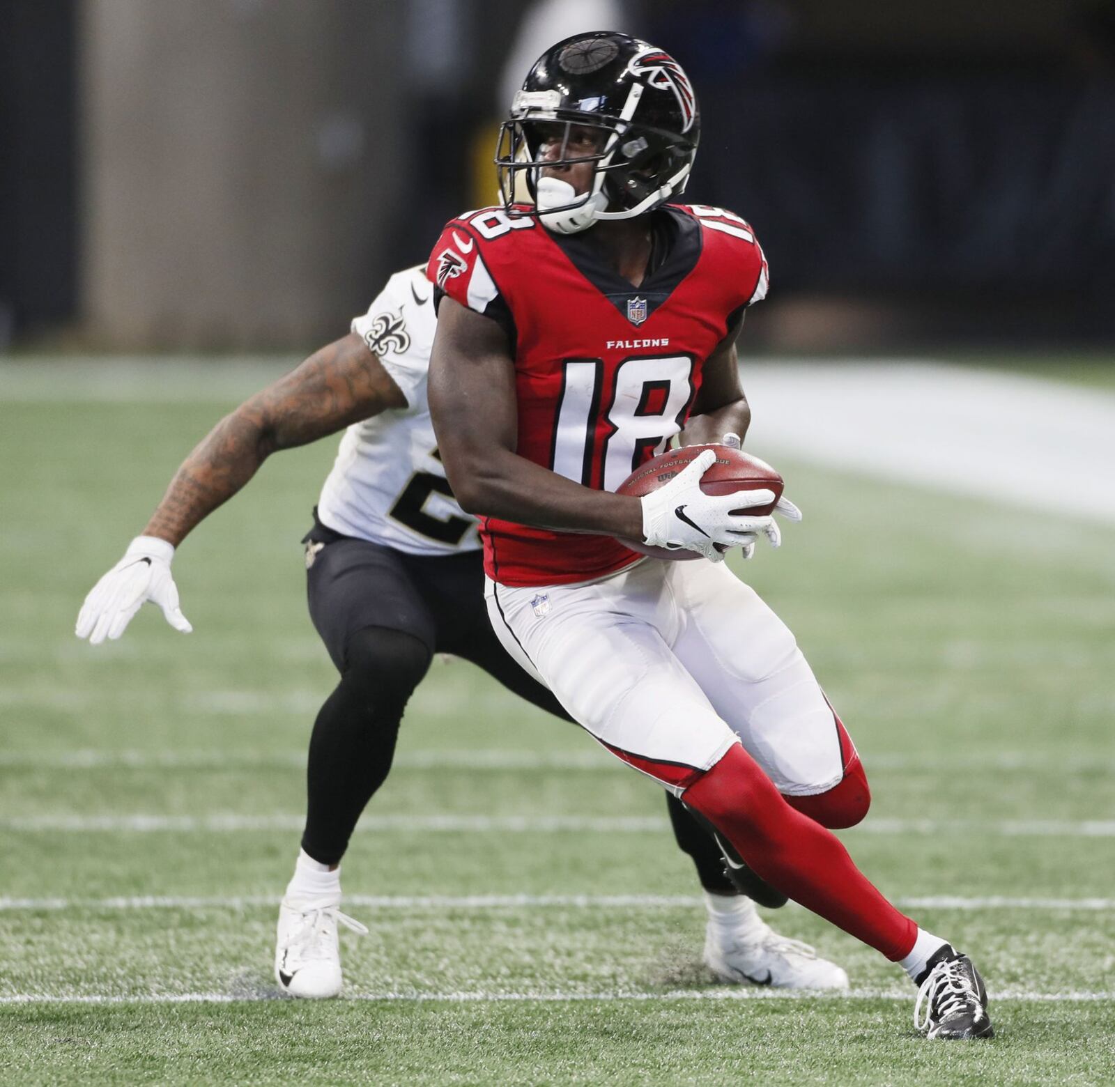Atlanta Falcons wide receiver Calvin Ridley (18) gains yardage after making a spin move on at drive that ended with his second touchdown reception. The Atlanta Falcons played the New Orleans Saints in an NFL football game Sunday, Sept 23, 2018, at Mercedes-Benz Stadium in Atlanta, GA. BOB ANDRES /BANDRES@AJC.COM
