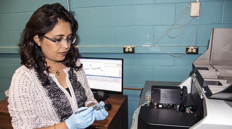 Air Force Research Laboratory research materials engineer Dr. Dhriti Nepal of the AFRL Composites Performance team performs nano-IR characterization of a nanocomposite material in the microscopy laboratory. (U.S. Air Force photo/David Dixon)