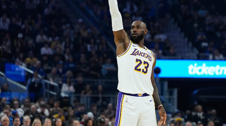Los Angeles Lakers forward LeBron James (23) watches as he makes a 3-point basket during the first half of an NBA basketball game against the Golden State Warriors, Saturday, Feb. 28, 2026, in San Francisco. (AP Photo/Godofredo A. Vásquez)