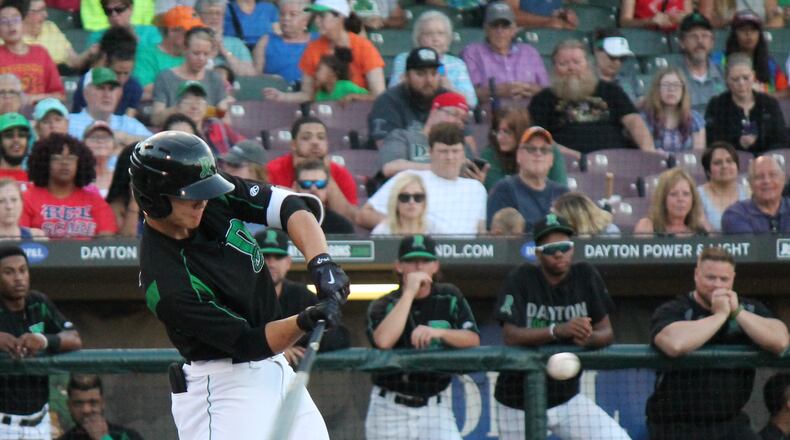 Dragons’ outfielder Stuart Fairchild sends a double to left field during the bottom of the first inning of Dayton’s second game of a doubleheader against the West Michigan Whitecaps at Fifth Third Field Thursday. Nick Dudukovich/CONTRIBUTED