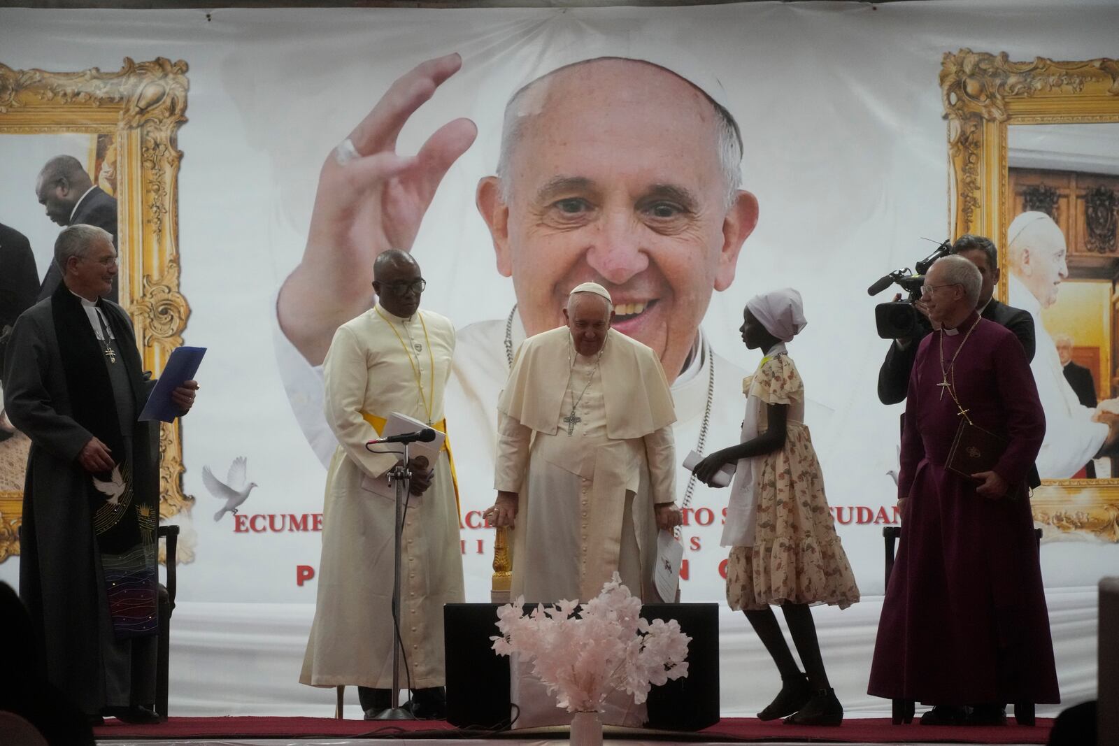 FILE - Pope Francis meets a displaced girl during a meeting with internally displaced persons at Freedom Hall in Juba, South Sudan, Feb. 4, 2023. (AP Photo/Gregorio Borgia, File)