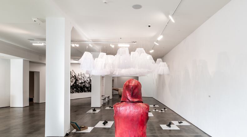 The Contemporary Dayton's "Lightness and Weight" exhibit, created by Susan Byrnes. The piece featured in this photo is known as "Red Hoodie." CONTRIBUTED