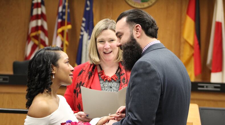 Tim Horn, 37, and Ariella Brown, 36, were married by Dayton Mayor Nan Whaley on Valentine’s Day at City Hall. CORNELIUS FROLIK/STAFF