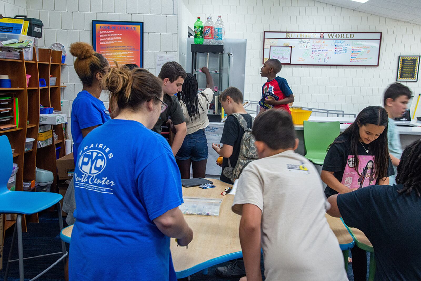 Children at the Prairies Youth Center enjoy an arts and crafts activity at the Prairies Youth Center on June 22. U.S. AIR FORCE PHOTO/AIRMAN 1ST CLASS JAMES JOHNSON