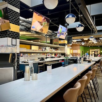 The food court at the former Miami Valley Centre Mall in Piqua has been transformed into The Social at Piqua Center, a dining and entertainment destination. NATALIE JONES/STAFF