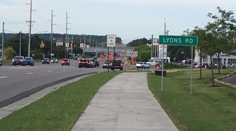 A $1.8 million project near the Dayton Mall includes new sidewalks along Ohio 741 and Lyons Road. NICK BLIZZARD/STAFF